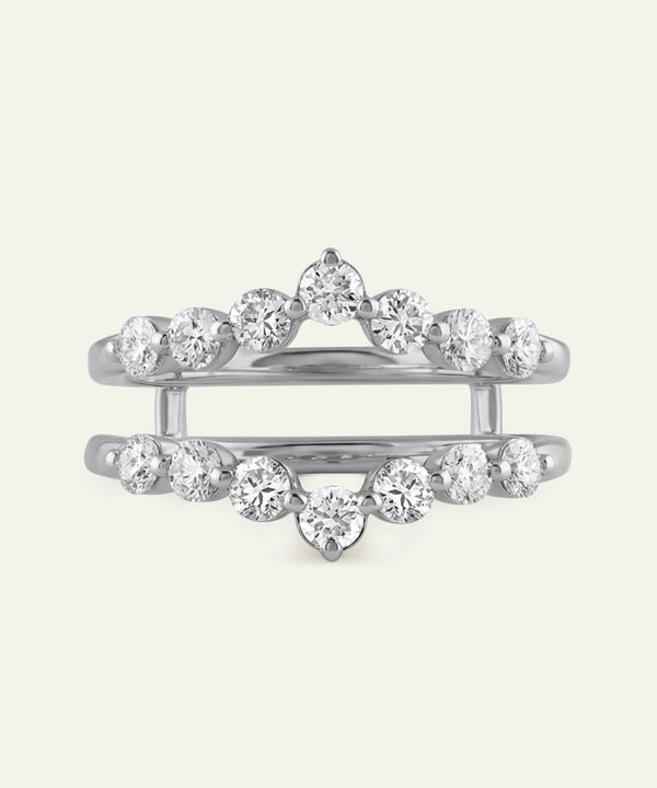 Silver ring with multiple diamonds on a white background