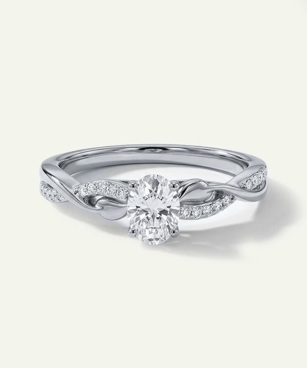 Silver ring with a diamond on a white background