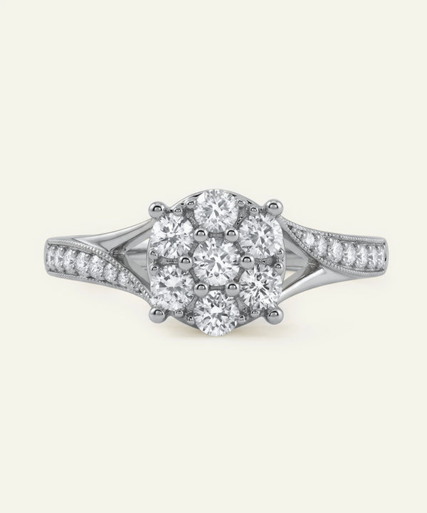Diamond ring with a central oval-shaped diamond and smaller diamonds on a white background