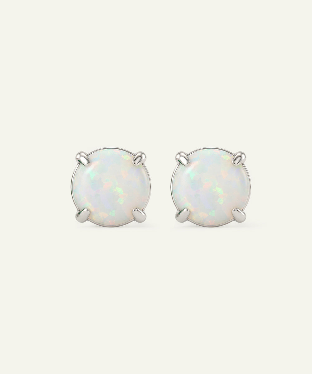 Pair of opal stud earrings on a white background