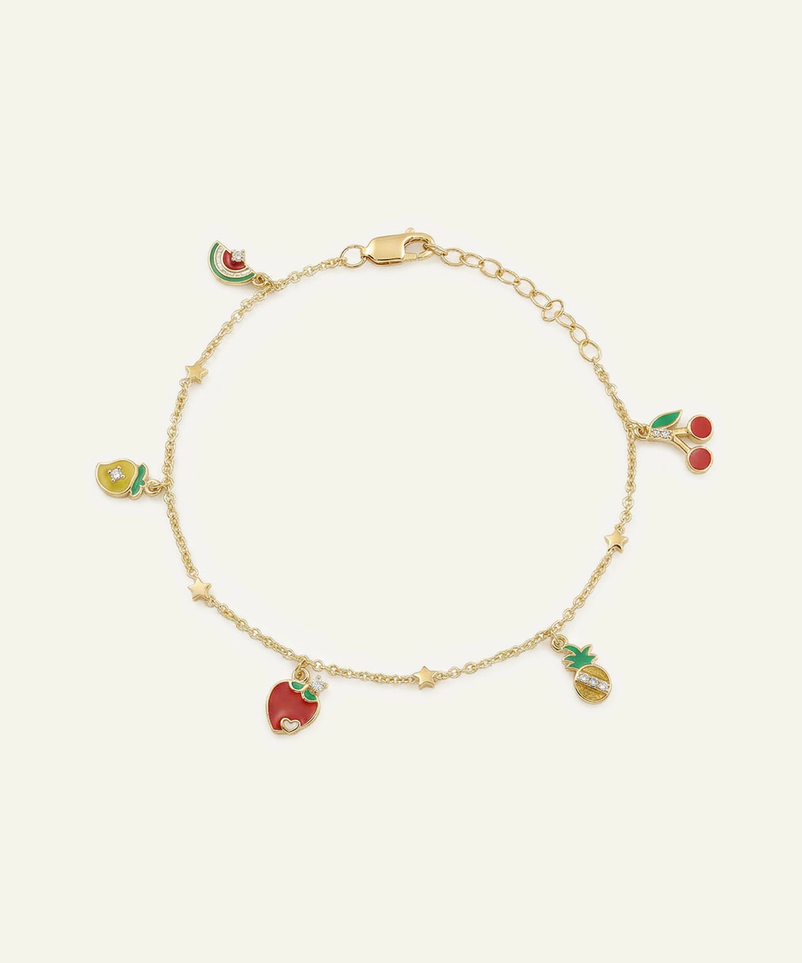 Gold bracelet with colorful fruit charms on a white background