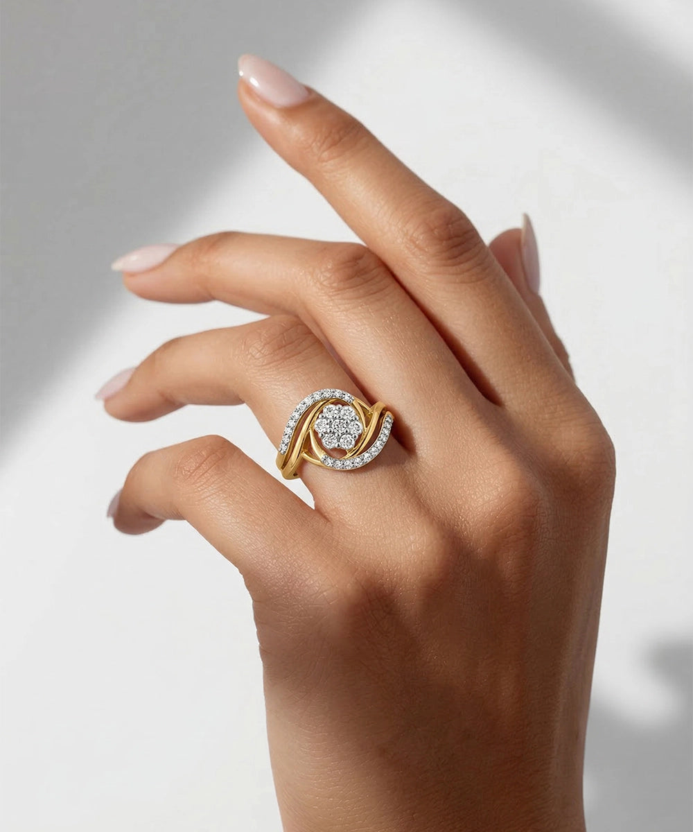 Gold ring with diamonds on a hand against a neutral background