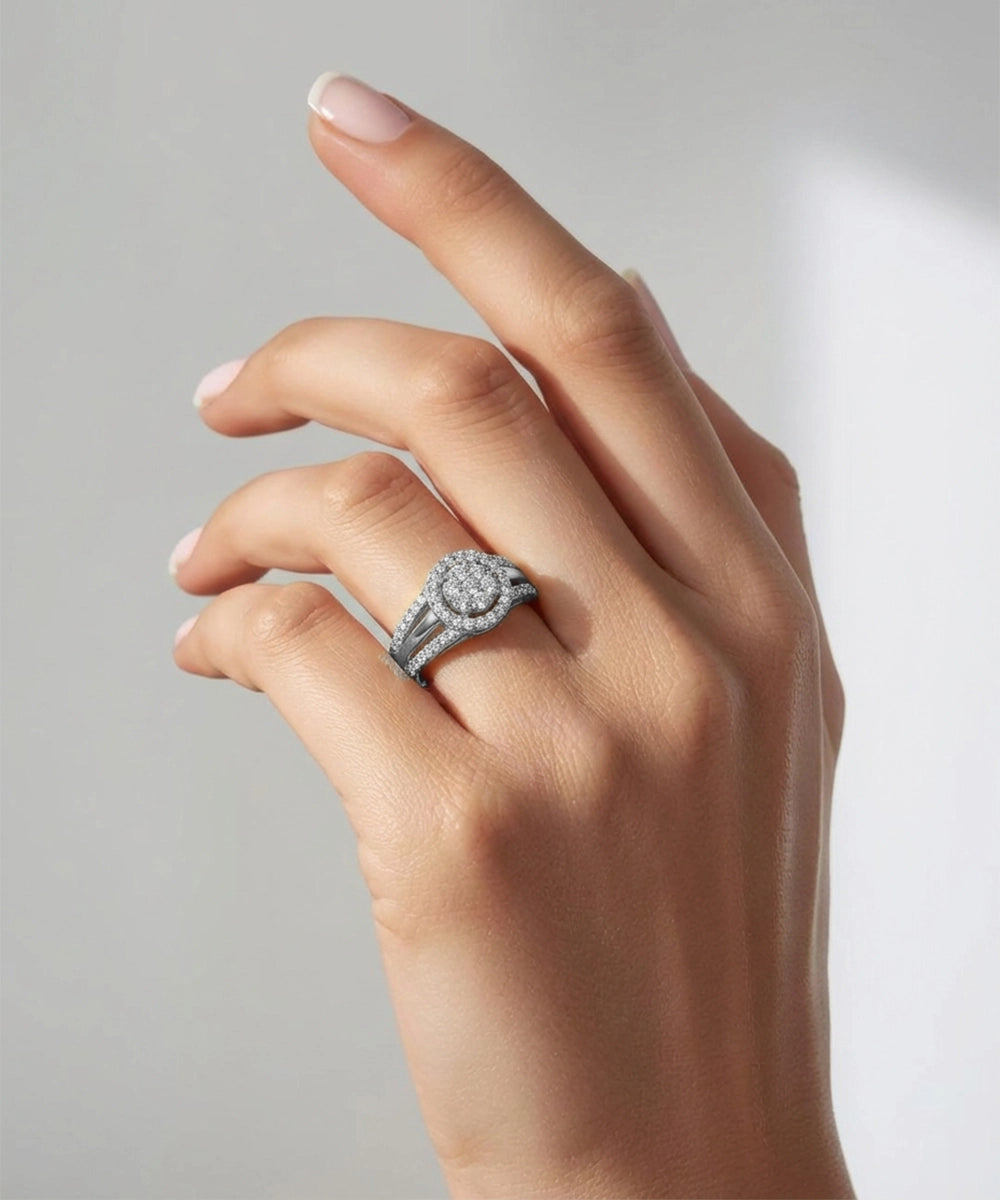 Hand wearing a diamond ring on a neutral background