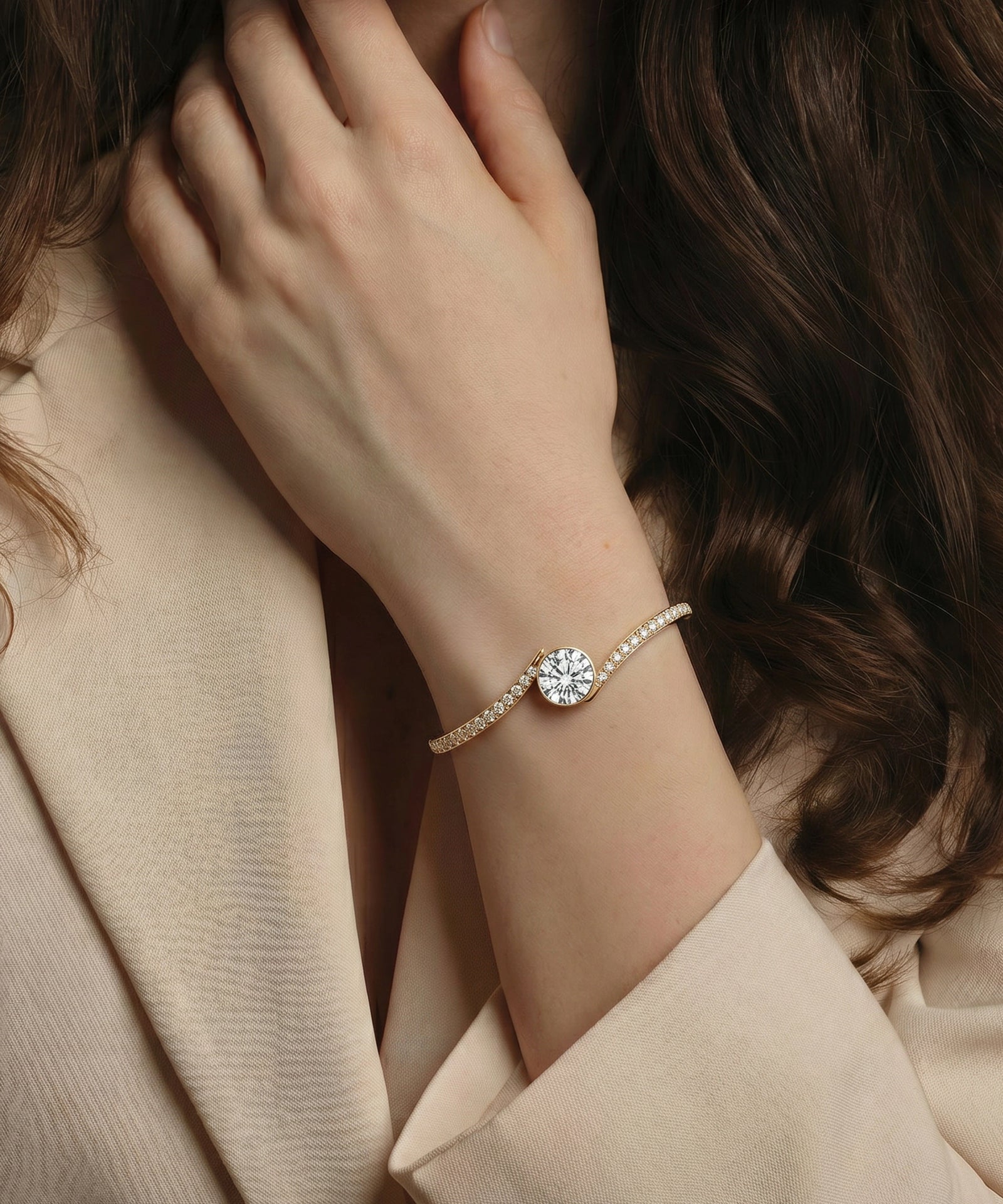 Pearl bracelet with a diamond on a person's wrist, wearing a beige coat.
