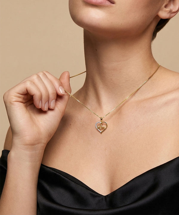 Woman wearing a silver necklace with a heart-shaped pendant on a beige background