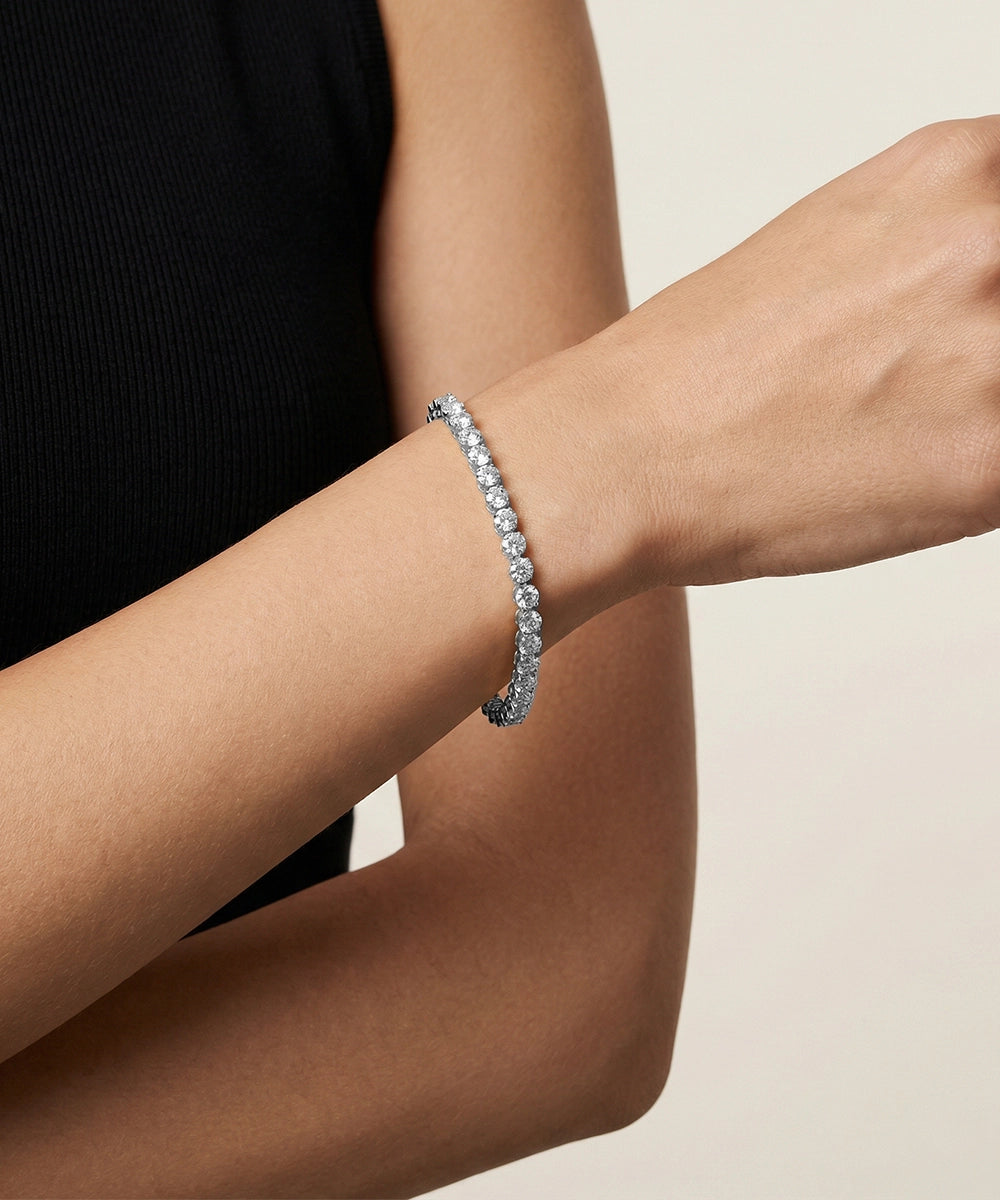 Bracelet on a wrist with a neutral background
