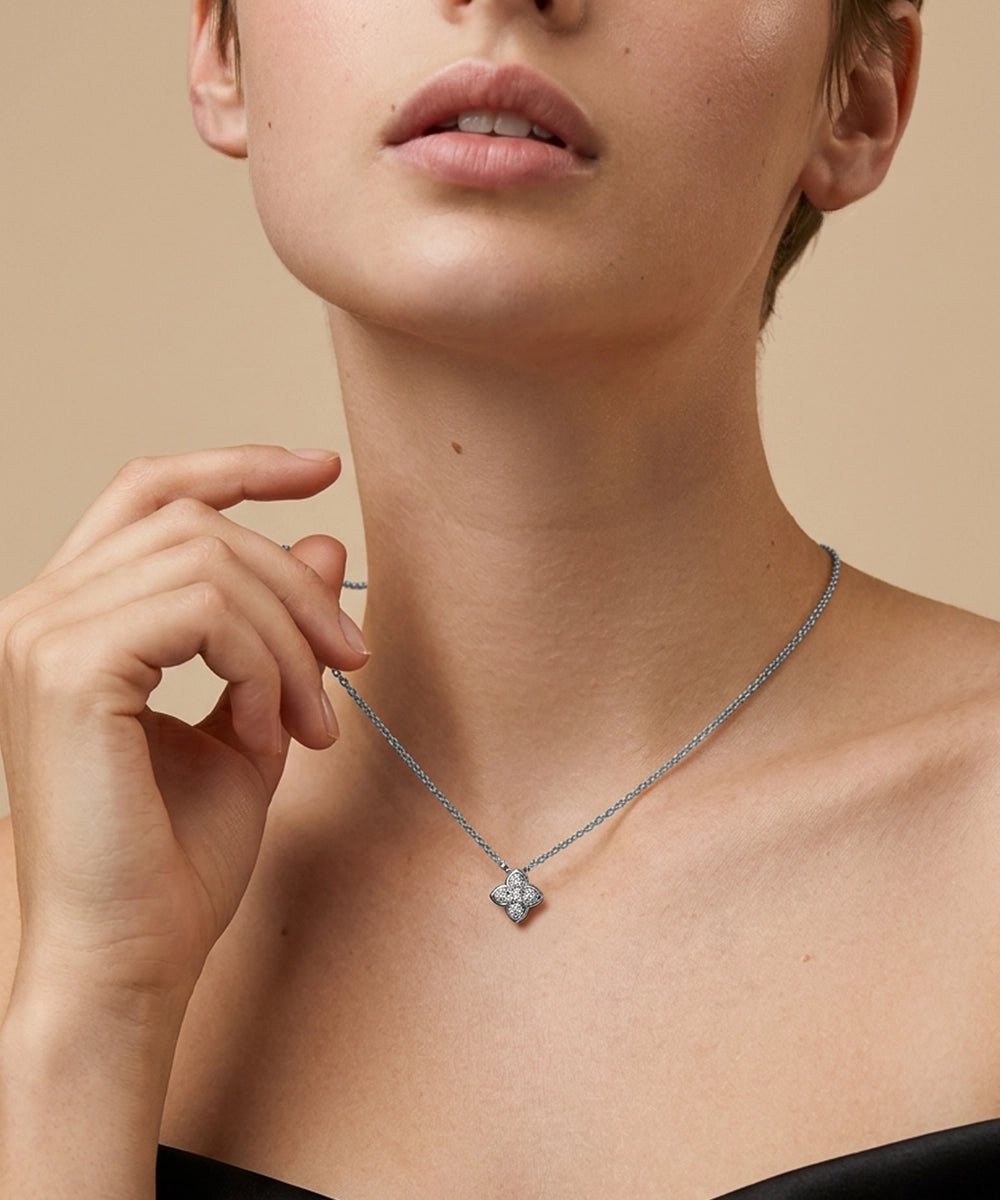 Close-up of a necklace with a pendant on a neutral background