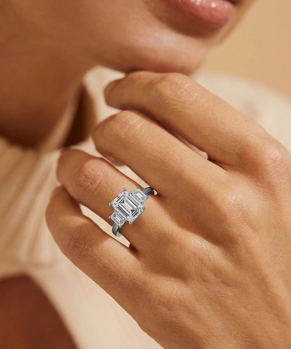 Diamond ring on a hand with a soft focus background