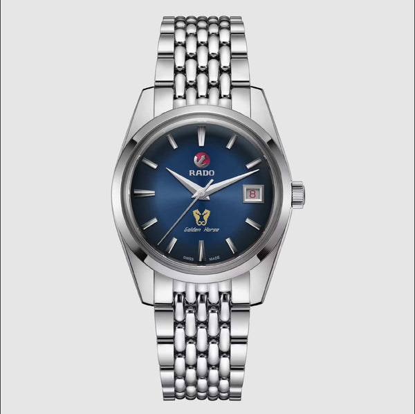 Silver watch with a blue dial on a light gray background