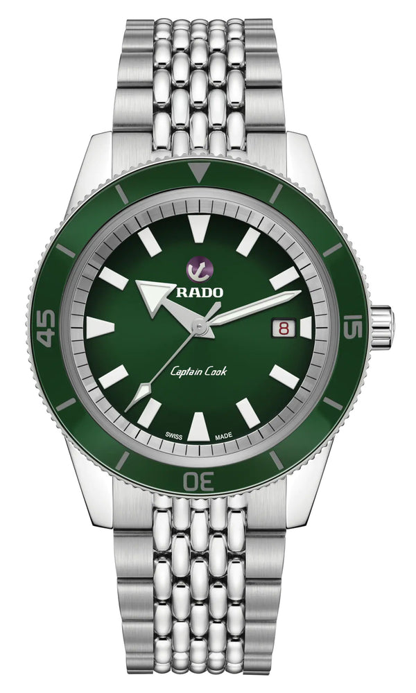 Green watch with silver bracelet on a white background