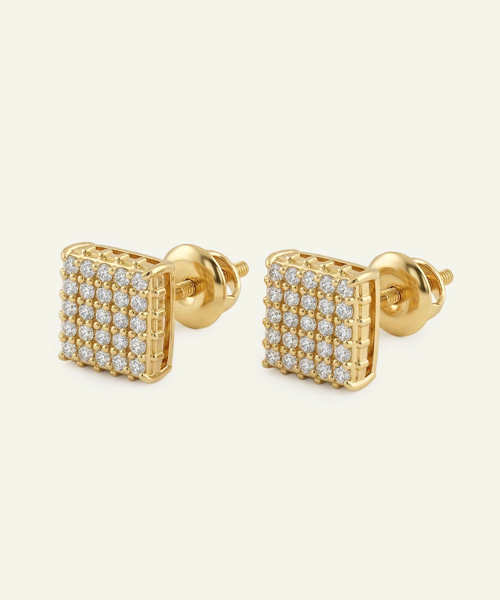 Gold square-shaped earrings with diamond accents on a white background