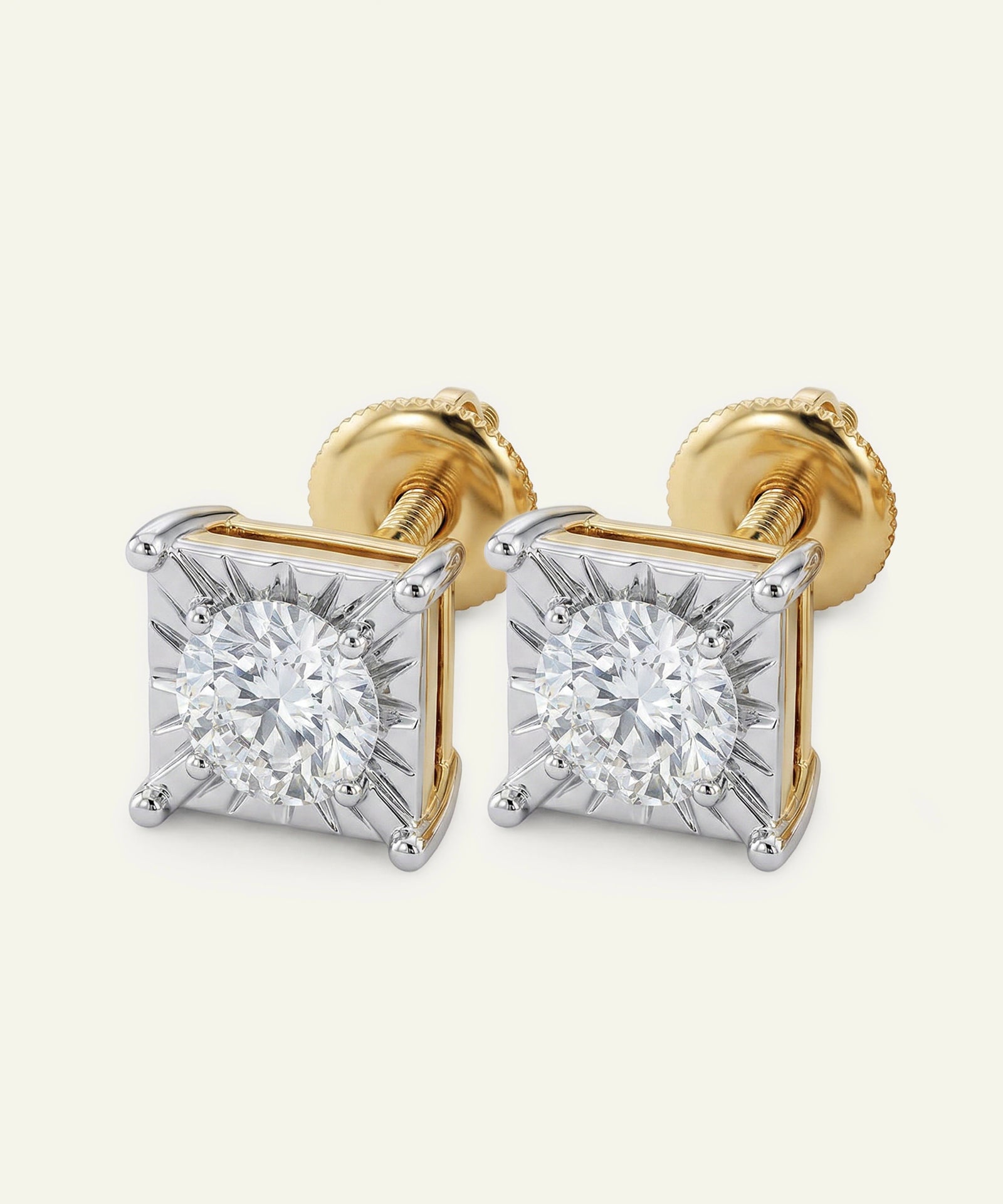 Gold and silver diamond stud earrings on a white background