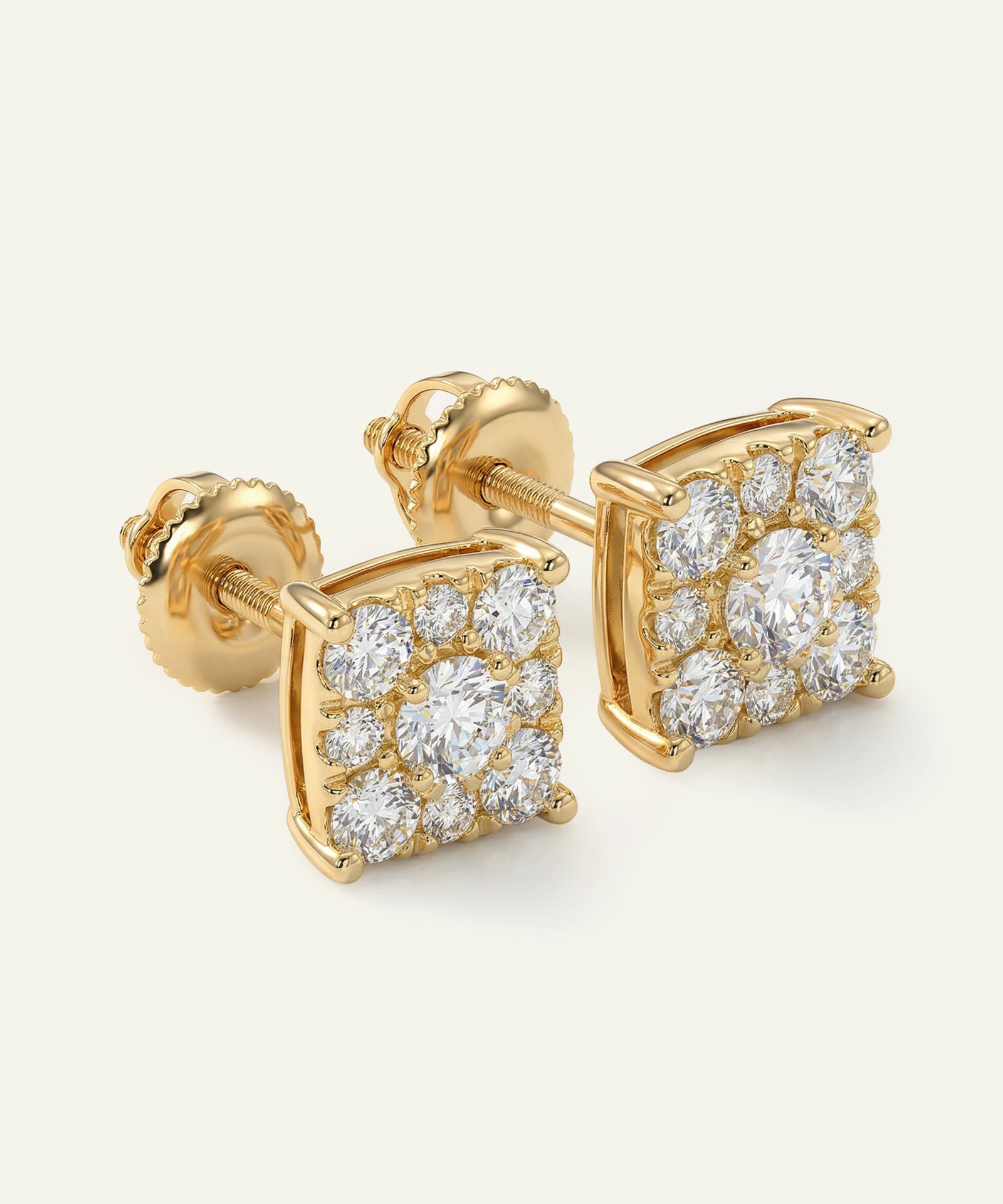 Gold earrings with diamond accents on a white background