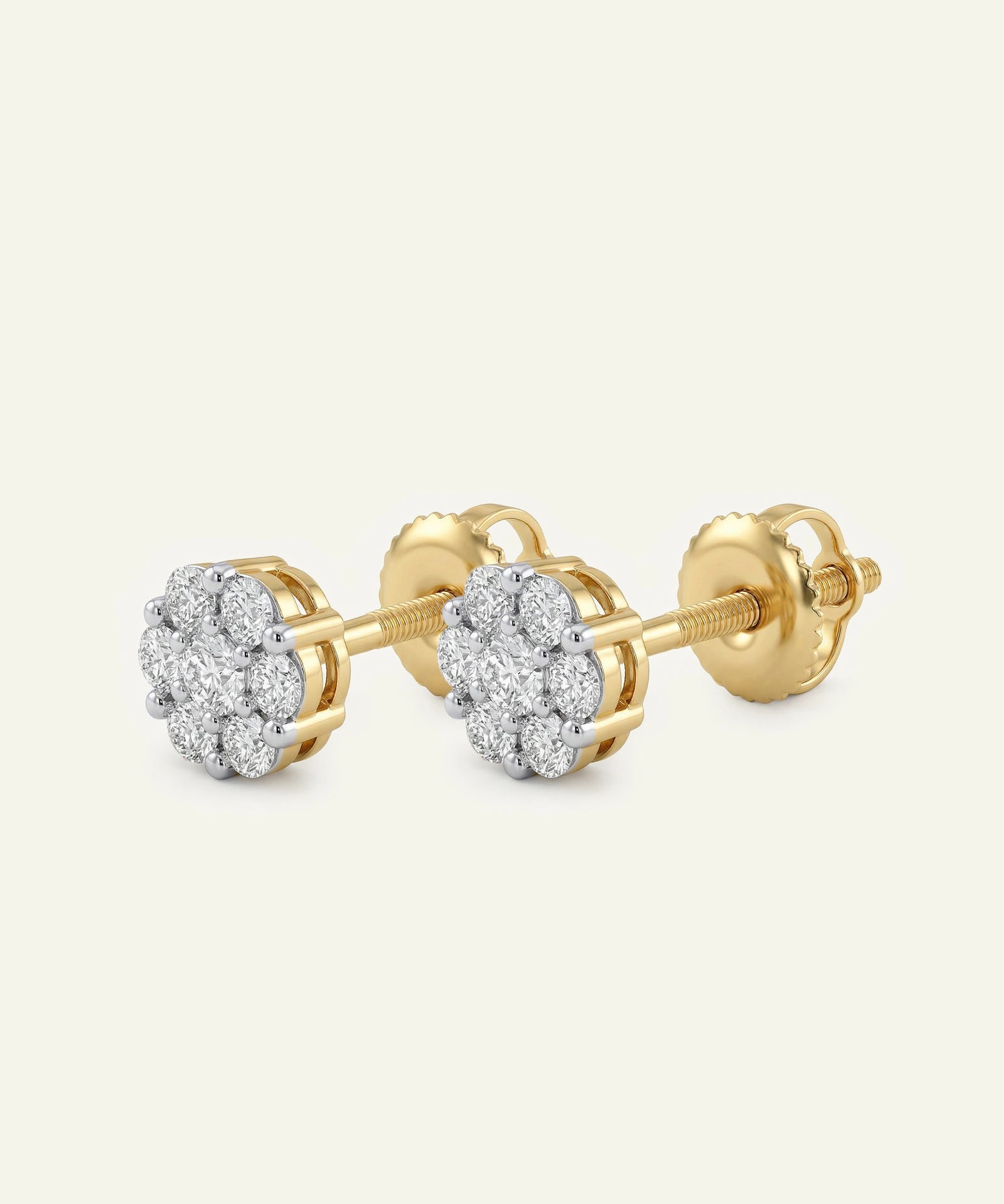 Gold earrings with diamond accents on a white background