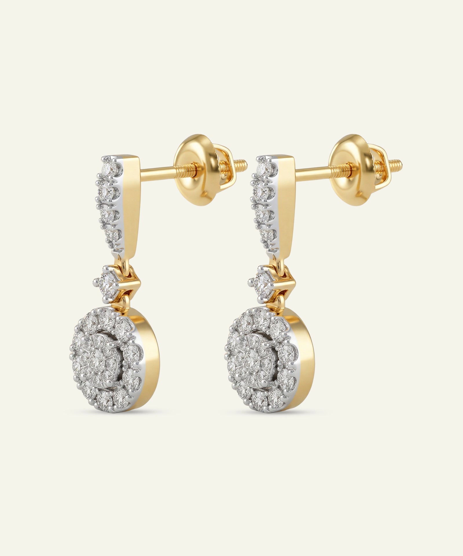 Gold and diamond earrings on a white background