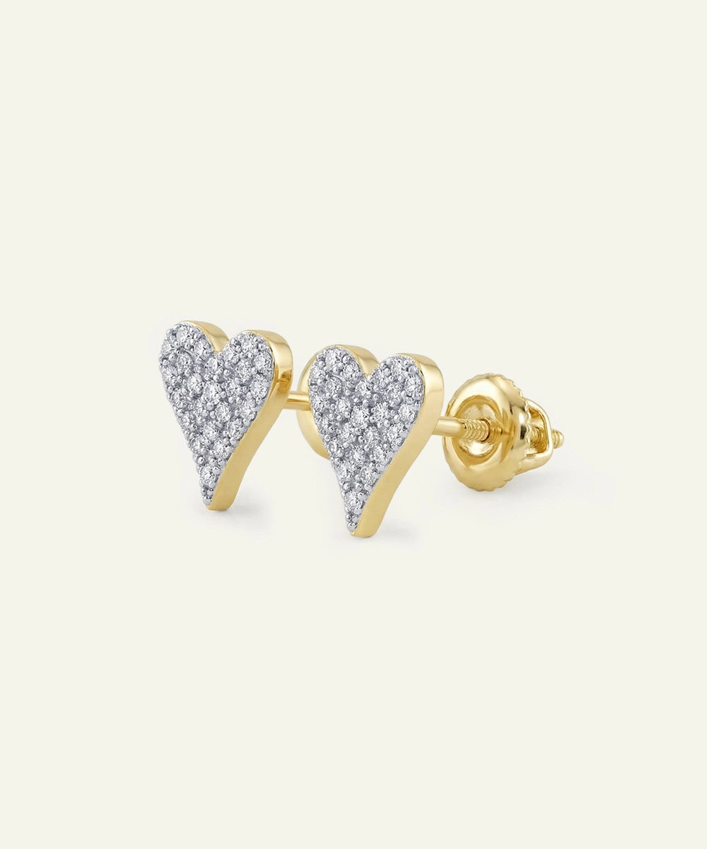 Heart-shaped earrings with gold and diamond details on a white background