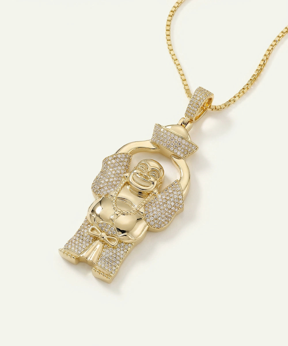 Gold monkey pendant with diamond accents on a gold chain against a white background