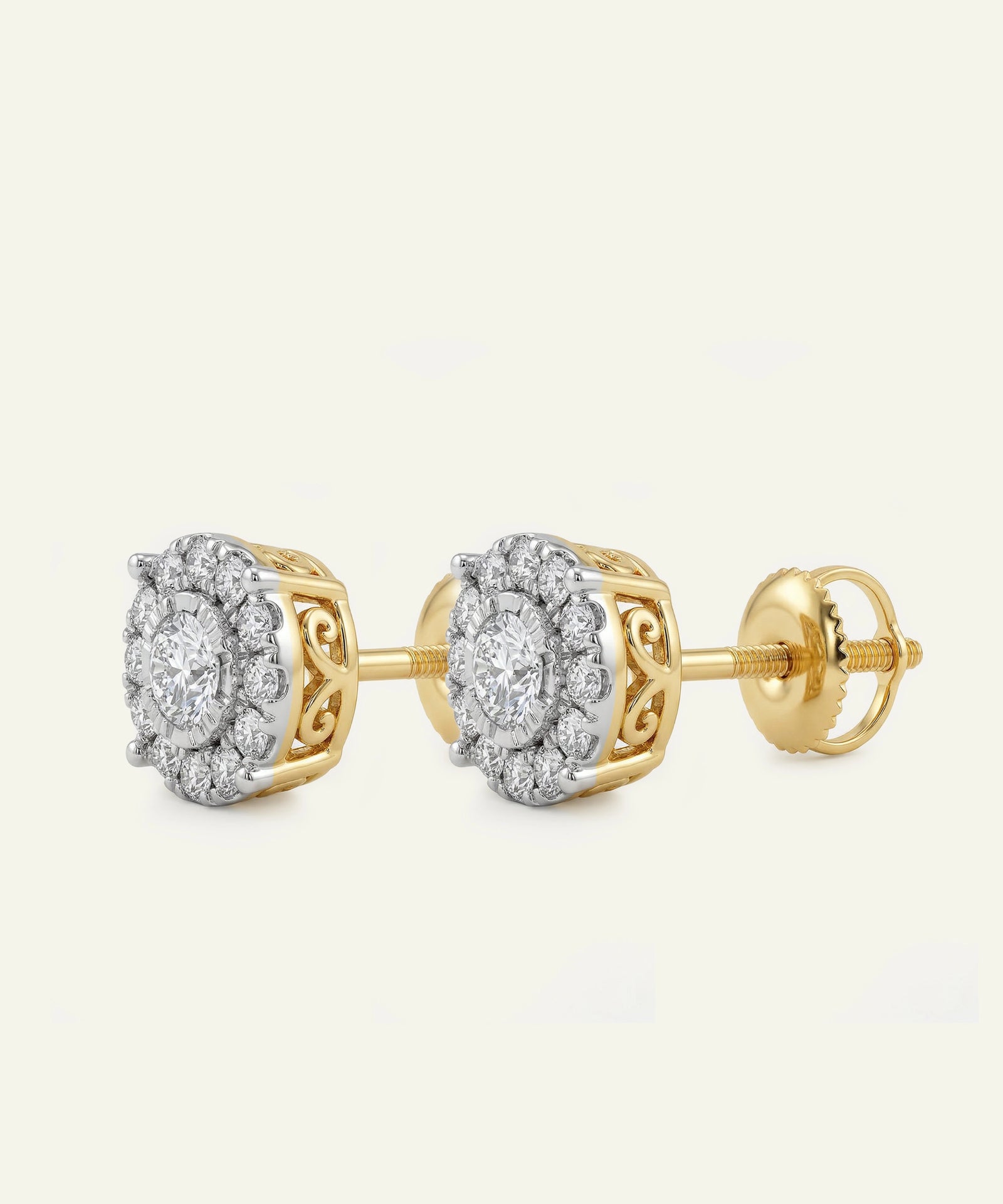 Gold and silver earrings on a light gray background