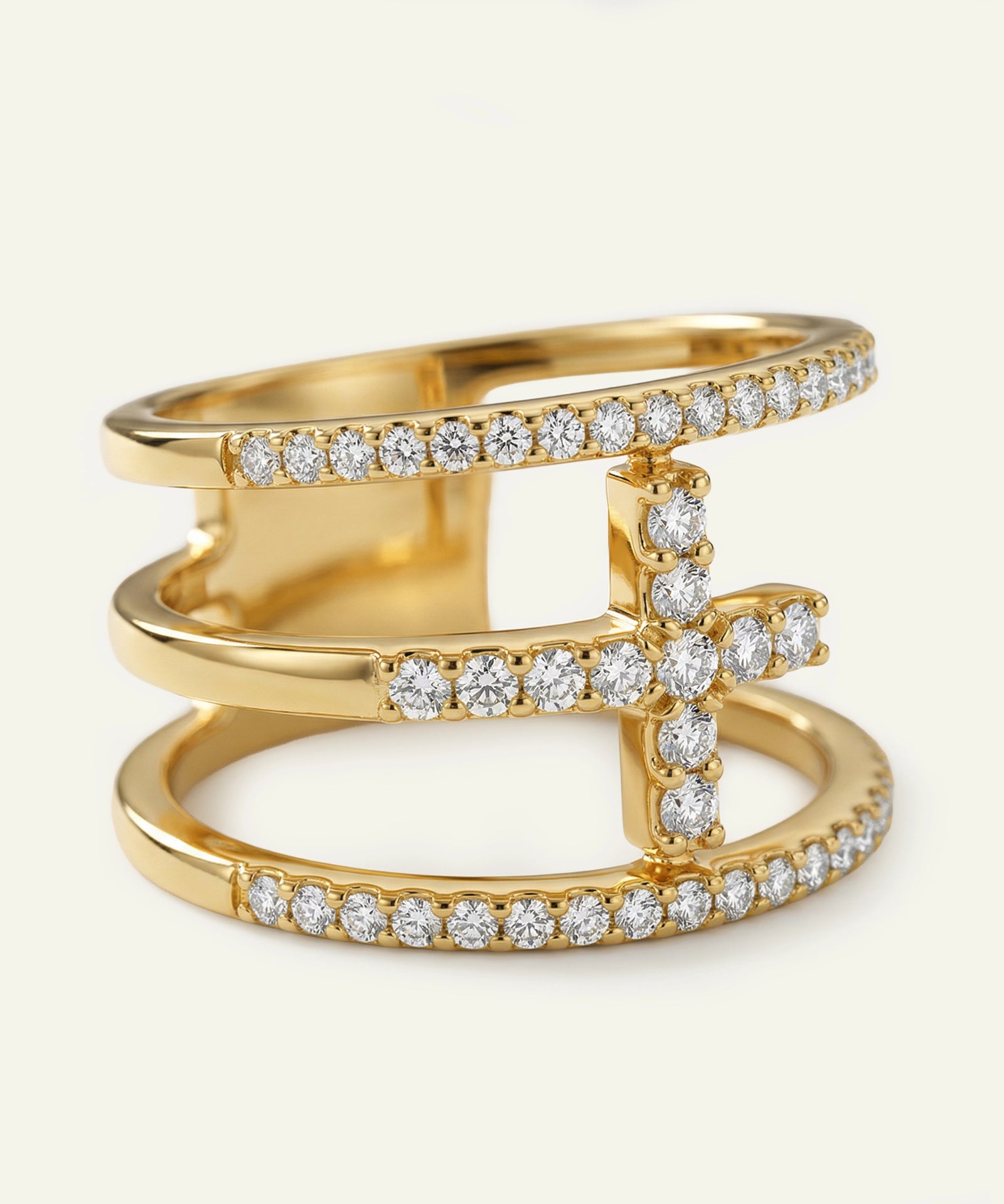 Gold ring with diamond accents on a white background