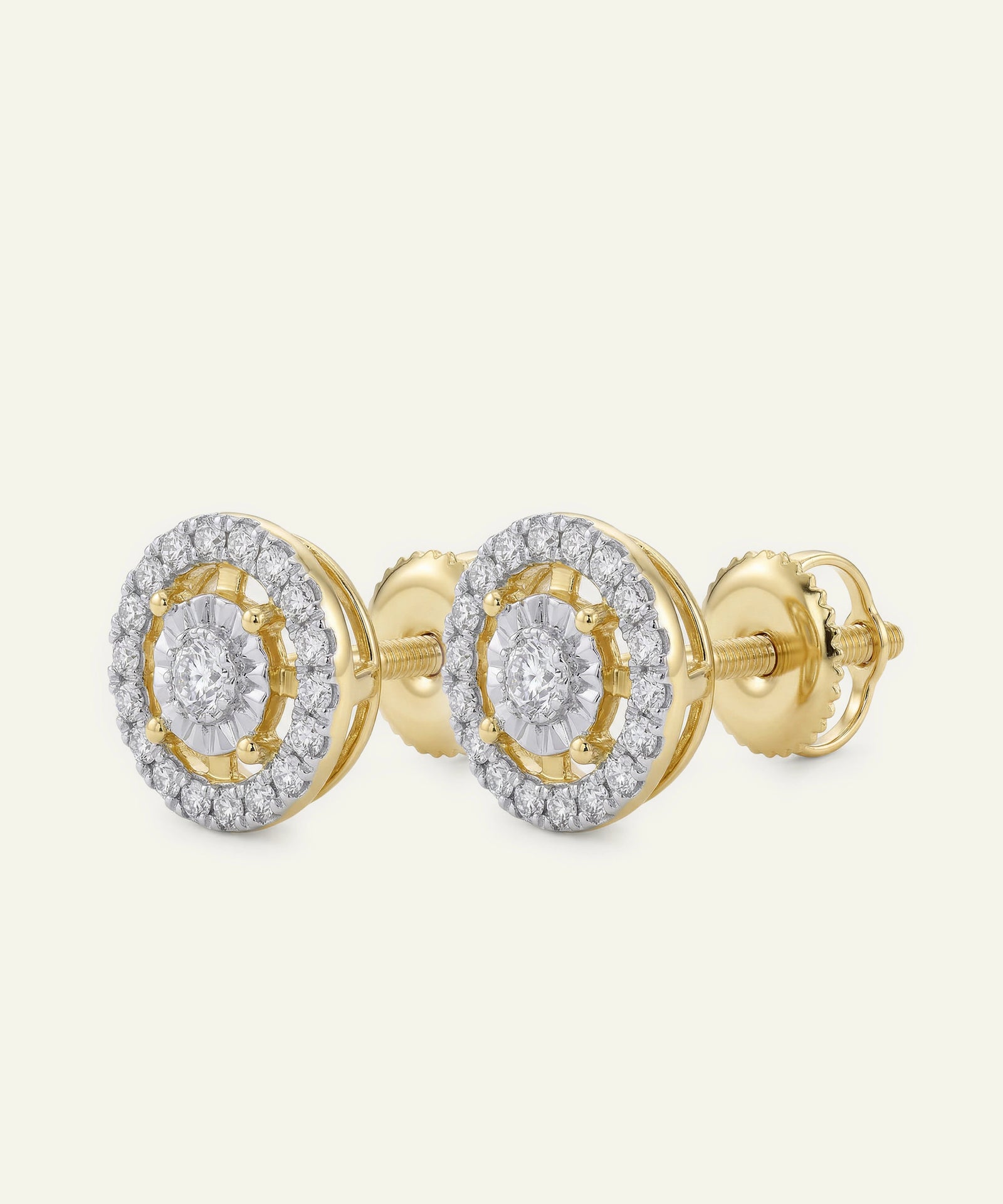 Gold and diamond earrings on a white background