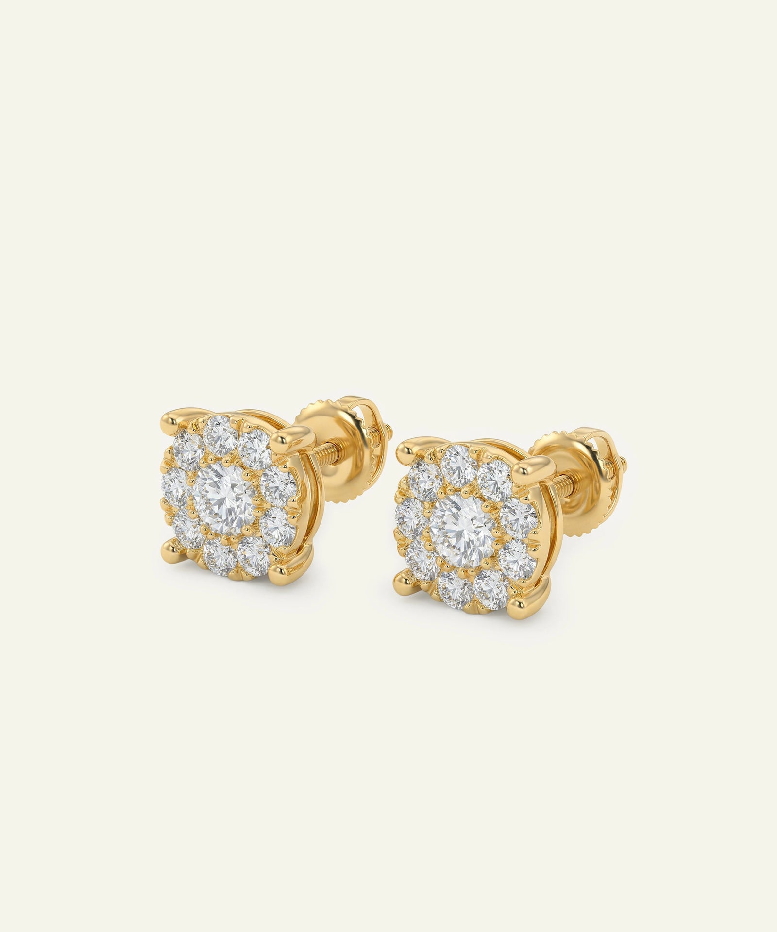 Gold earrings with diamond accents on a white background