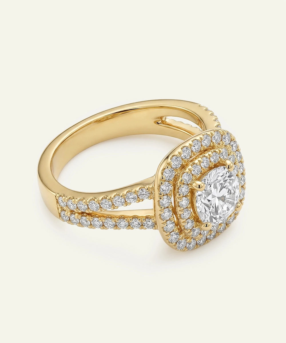 Gold ring with a large diamond and smaller diamonds on a light background