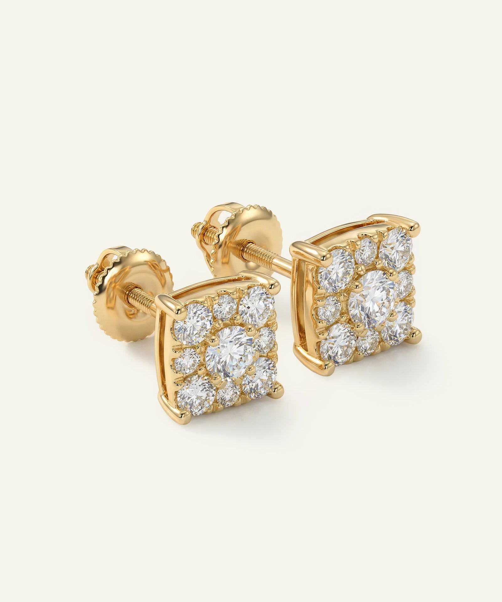 Gold earrings with diamond accents on a white background