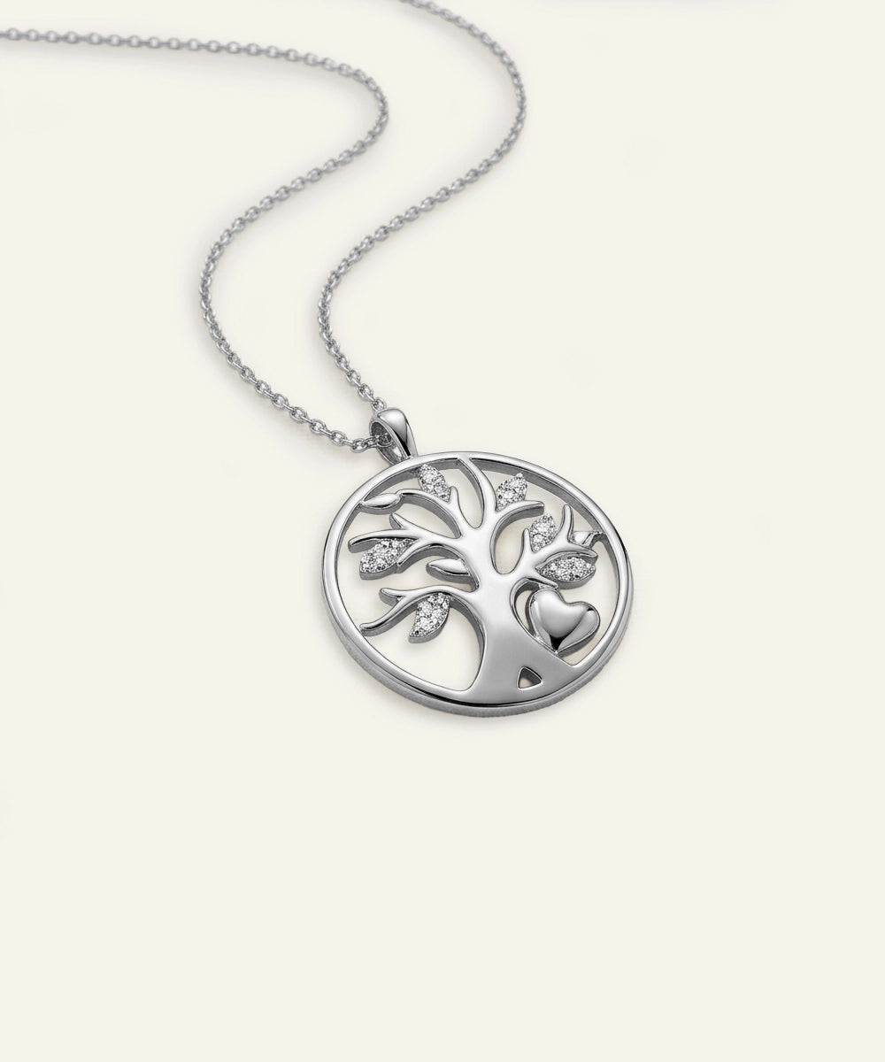 Silver necklace with a tree of life pendant on a white background