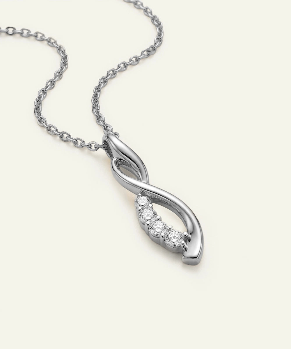 Silver necklace with a diamond pendant on a white background