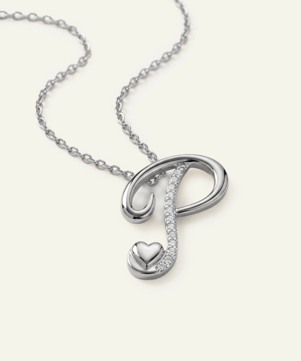 Silver necklace with an infinity symbol and heart pendant on a white background