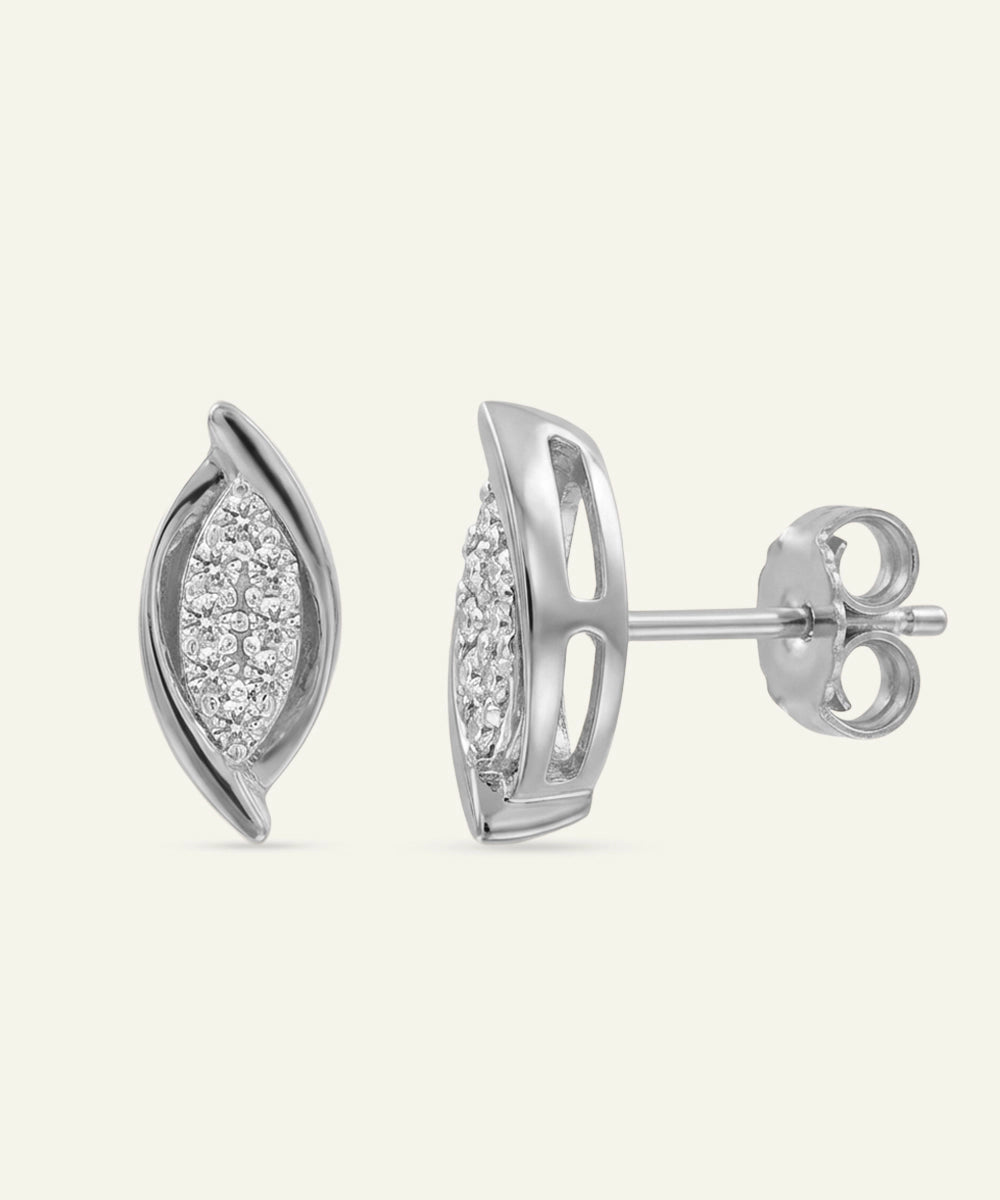Silver earrings with diamond accents on a white background