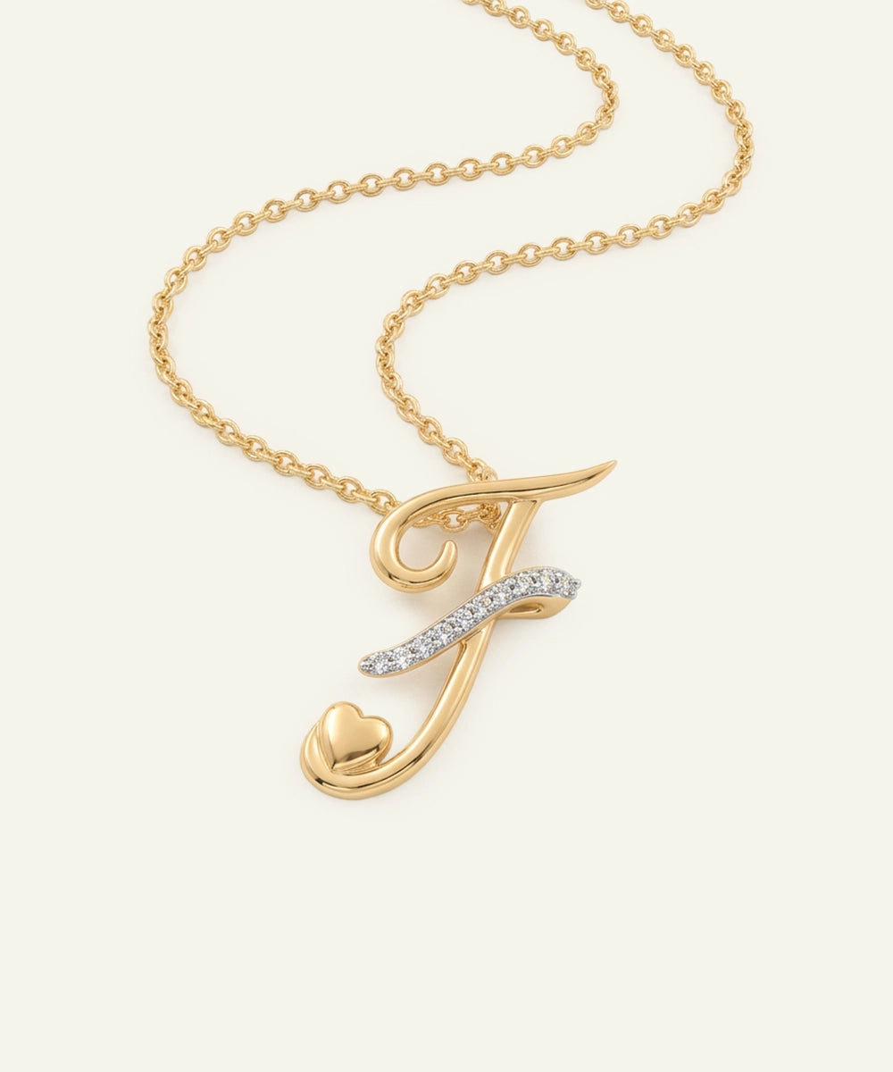 Gold necklace with a letter 'J' pendant on a white background