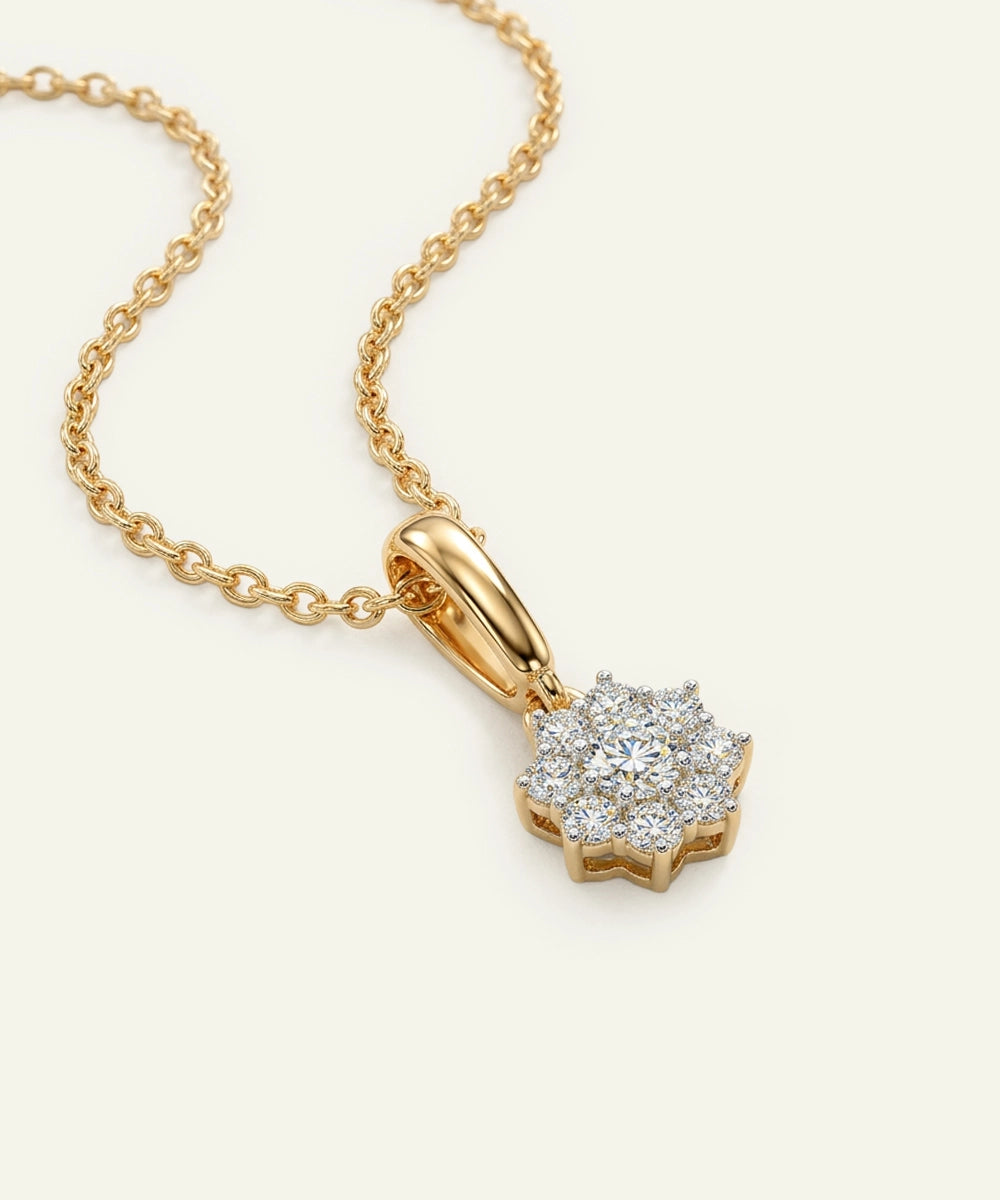 Gold necklace with a diamond pendant on a white background