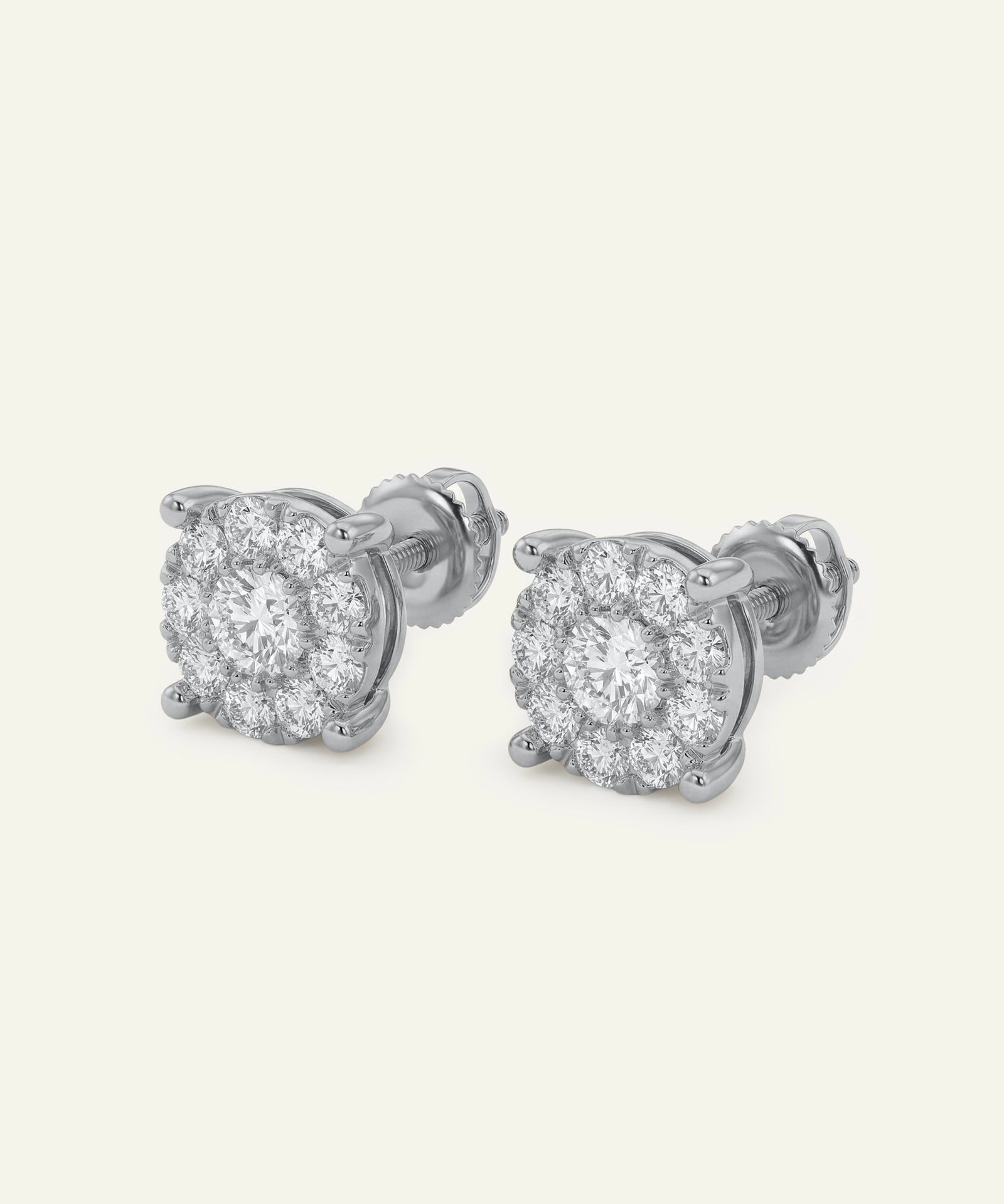 Pair of diamond stud earrings on a white background