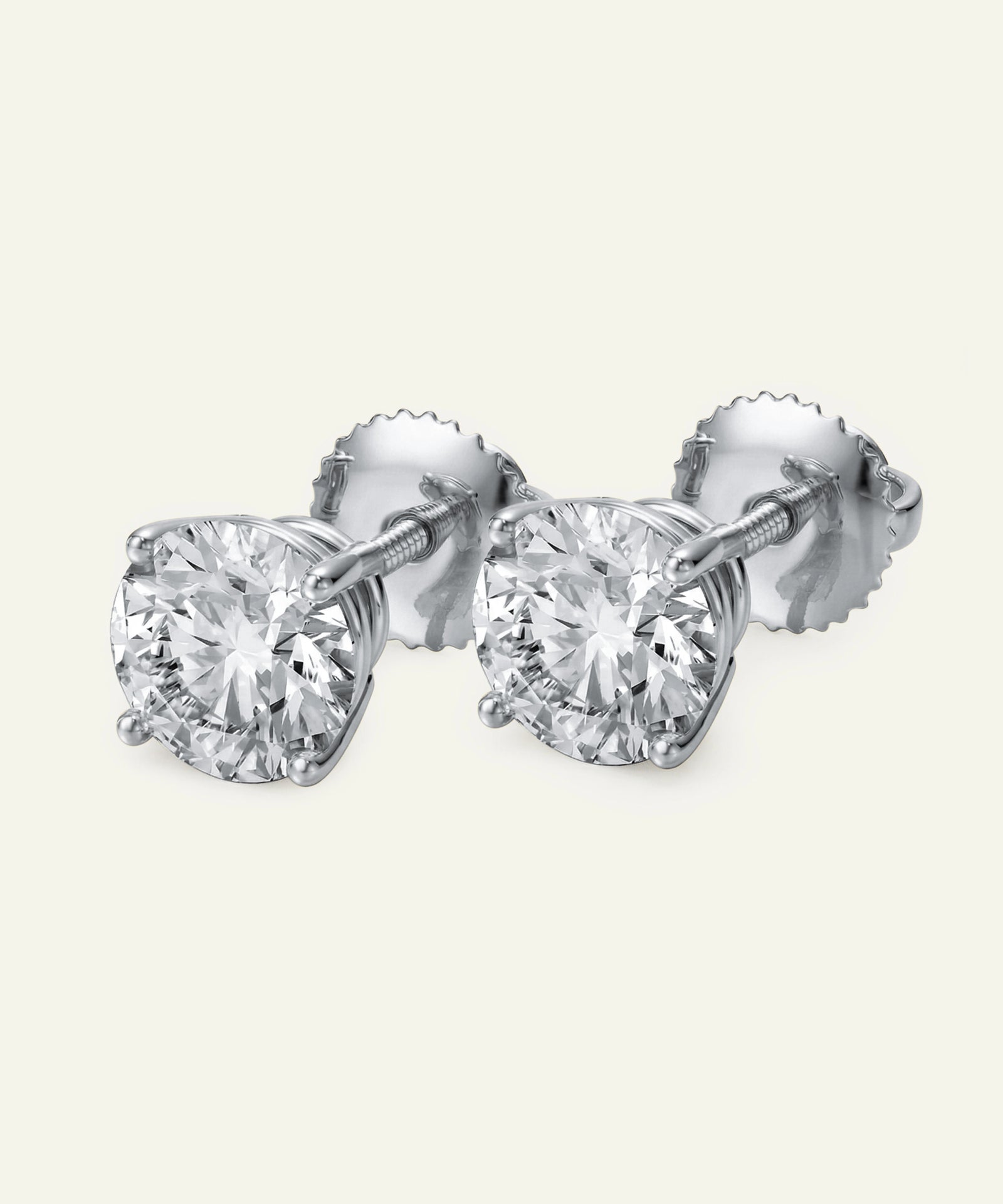 Pair of diamond stud earrings on a white background