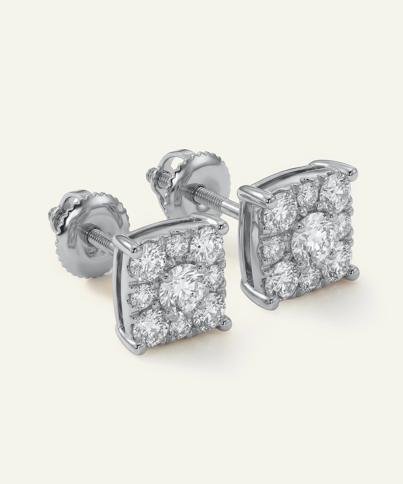 Pair of diamond stud earrings on a white background