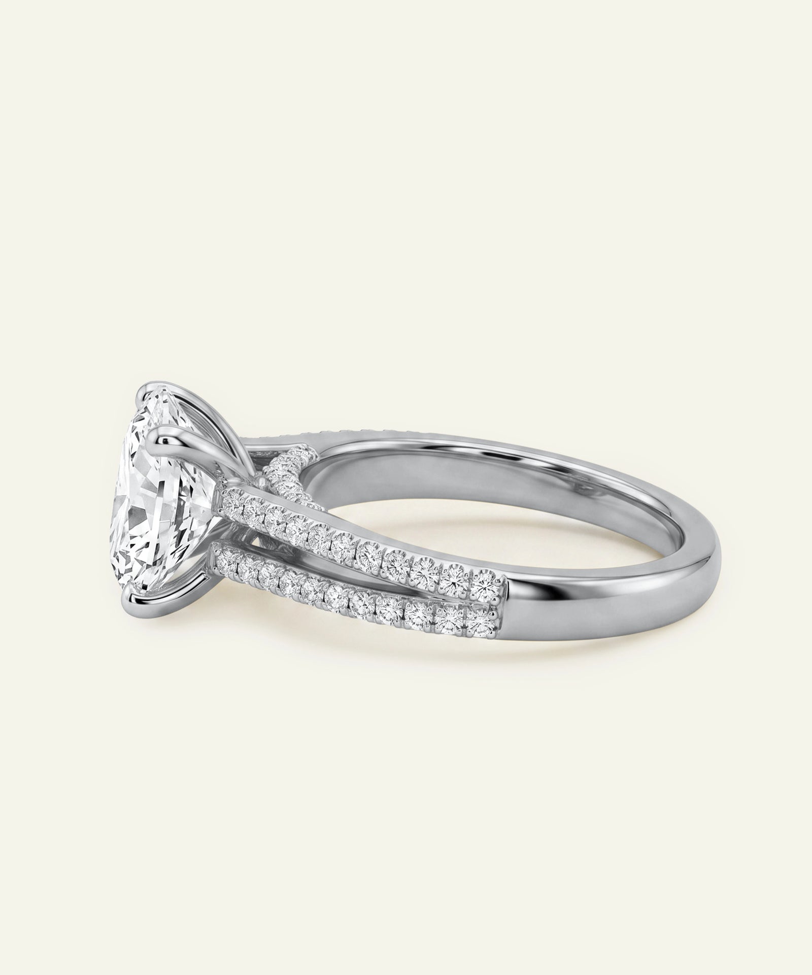 Diamond ring with a triangular center stone on a light beige background