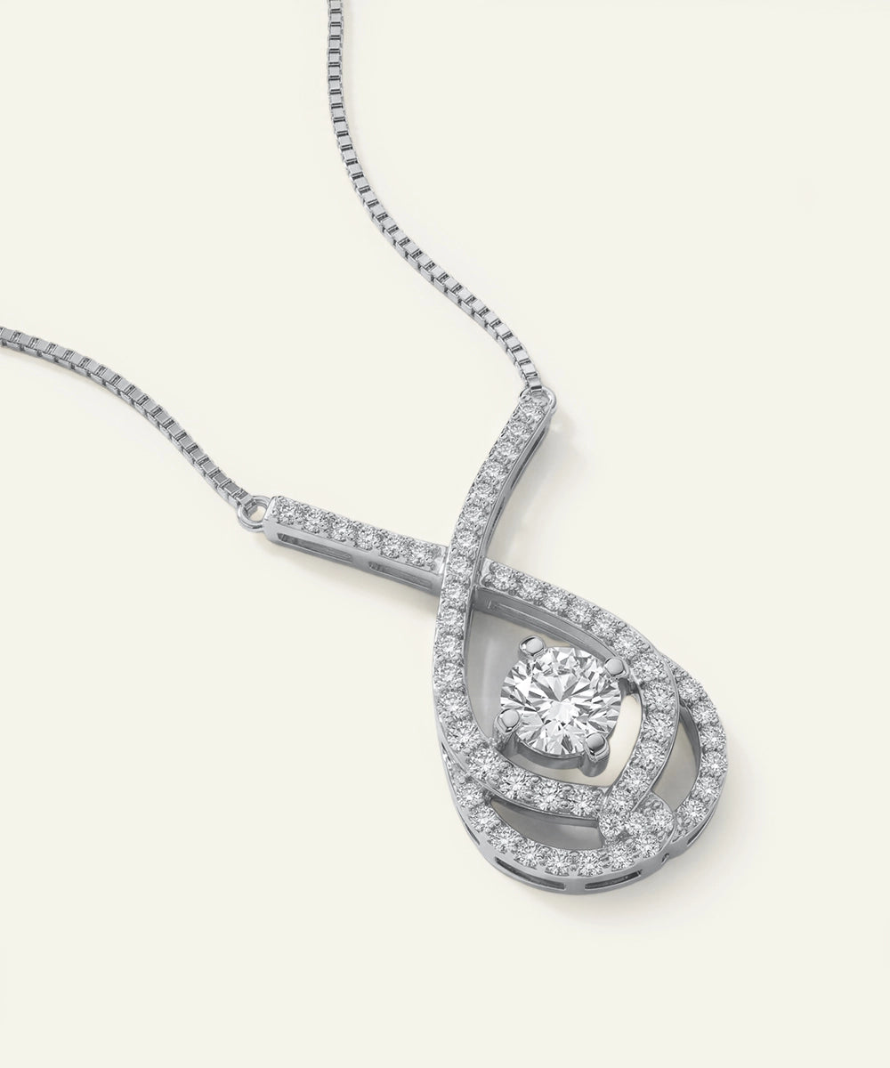 Silver necklace with a diamond pendant on a white background