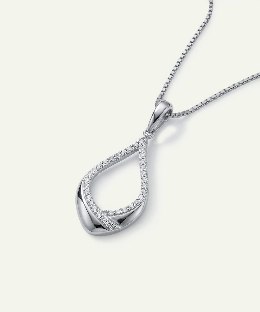 Silver necklace with a teardrop-shaped pendant on a white background