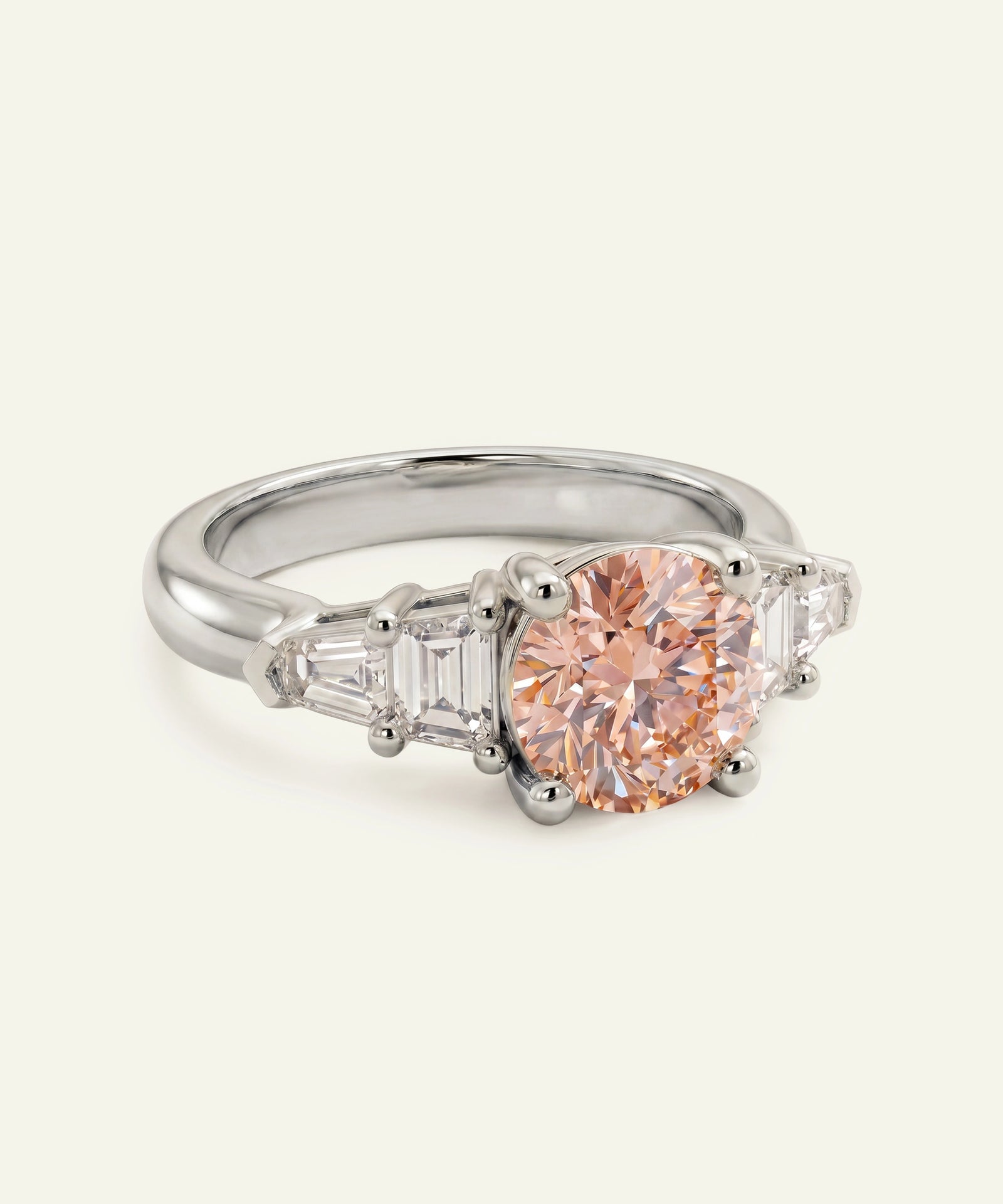 Diamond ring with a pink gemstone on a white background