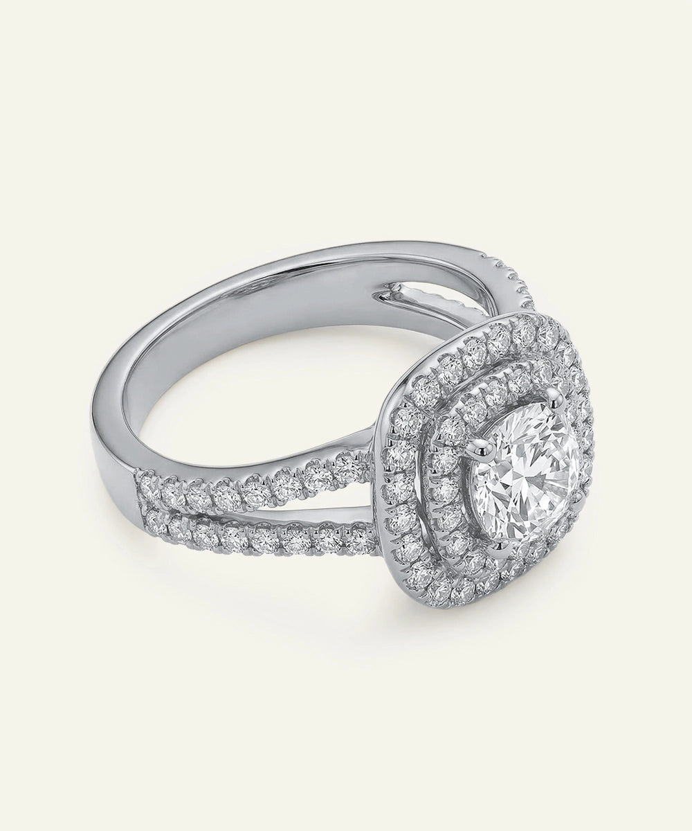 Silver ring with diamond accents on a white background
