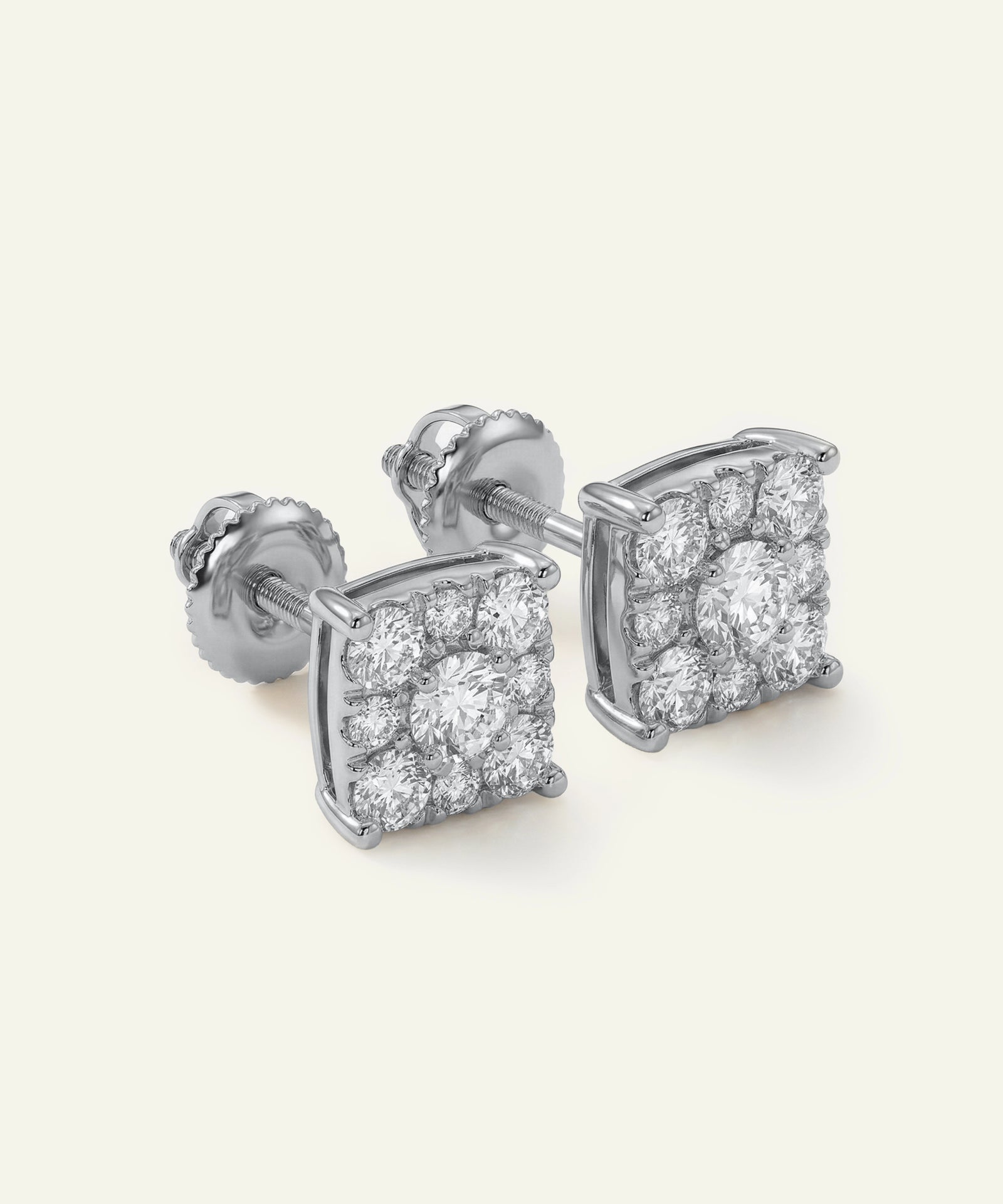 Pair of diamond stud earrings on a light gray background