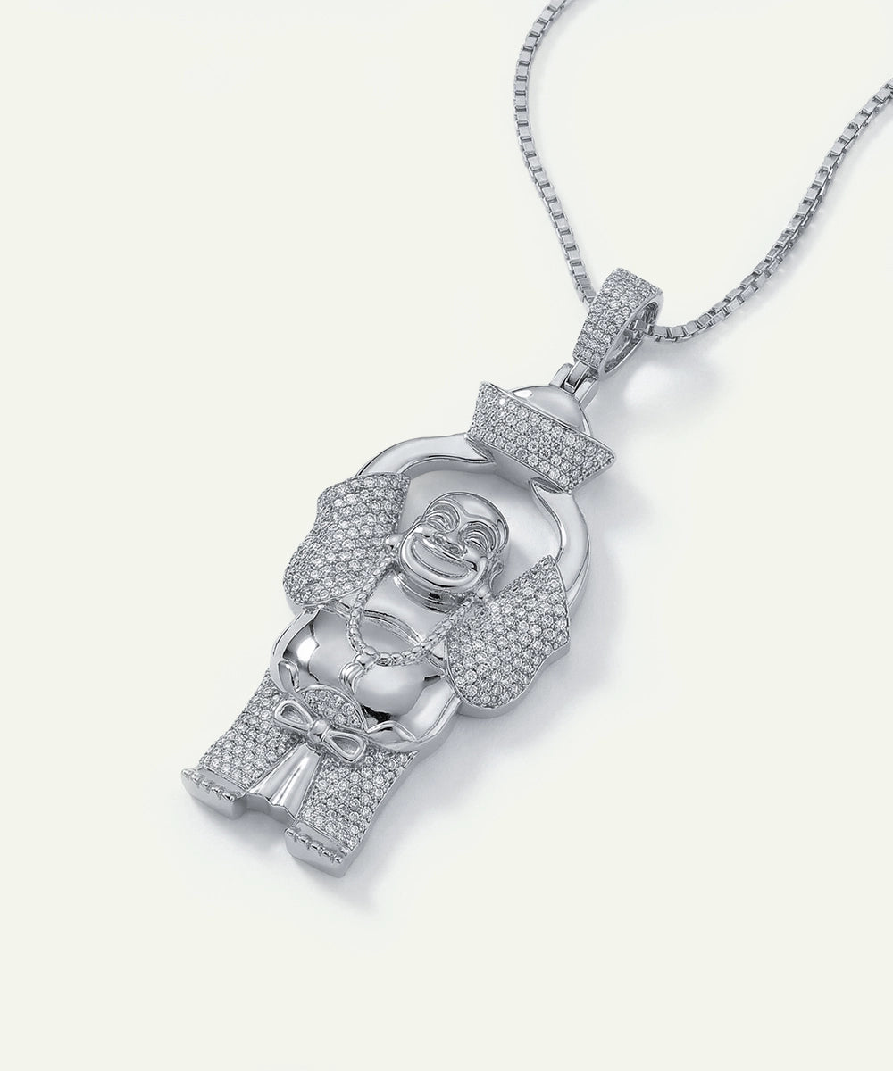 Silver pendant with intricate design on a white background