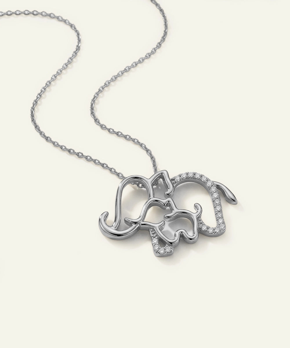 Silver elephant pendant necklace on a white background