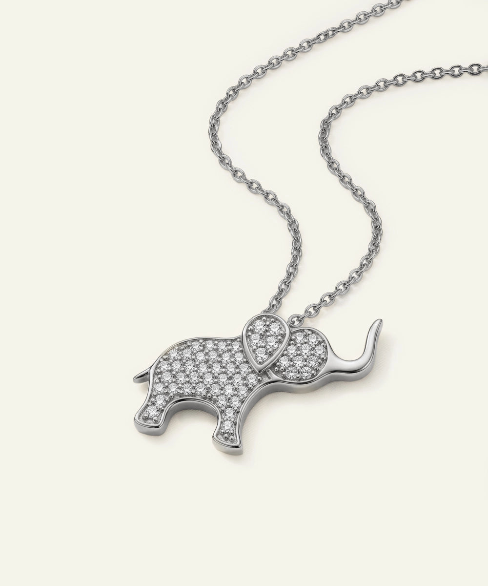 Silver elephant pendant necklace on a white background