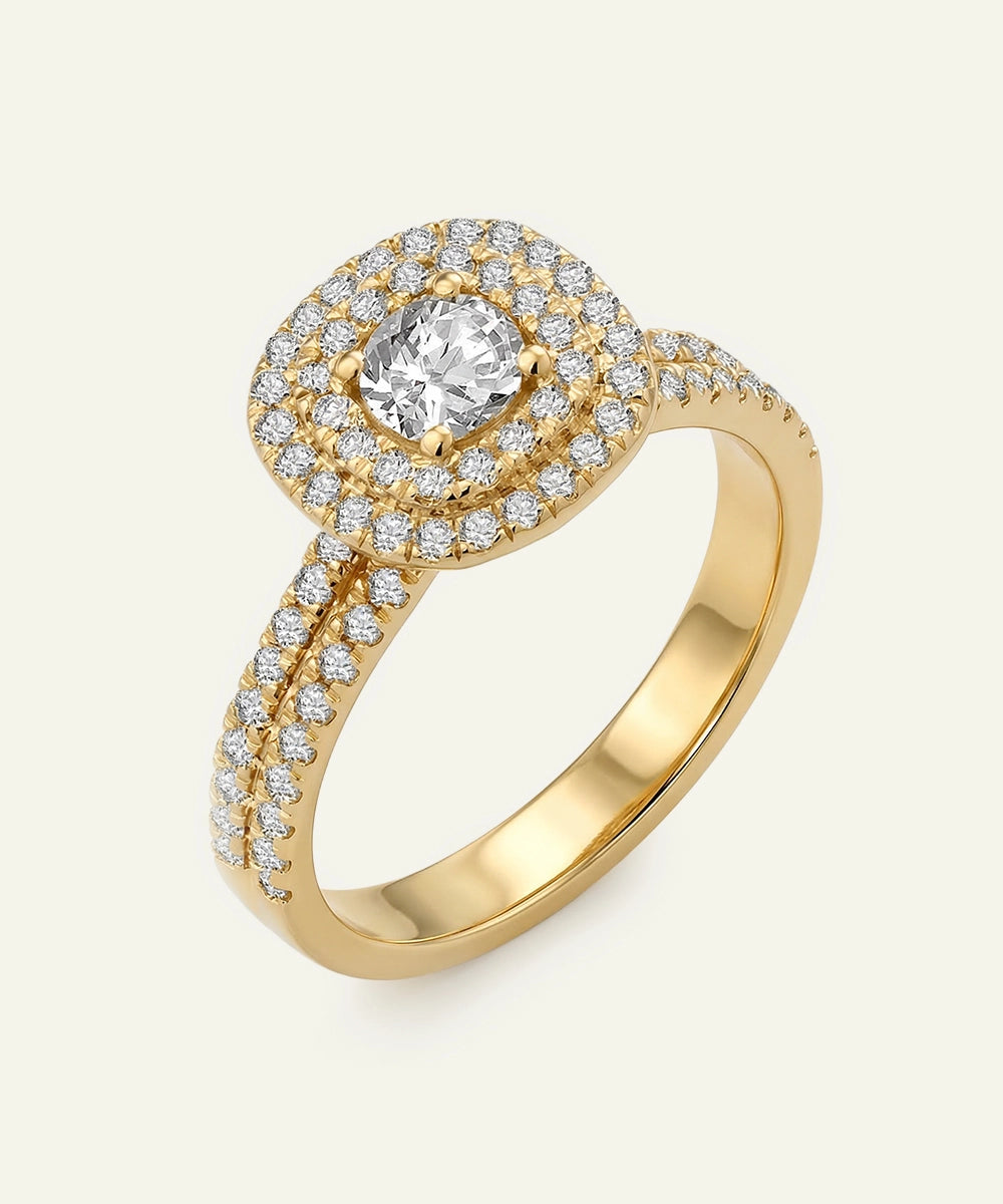 Gold ring with a diamond on a white background