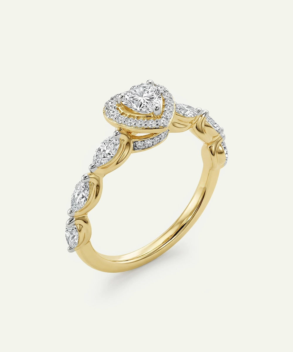 Gold ring with diamond accents on a light gray background