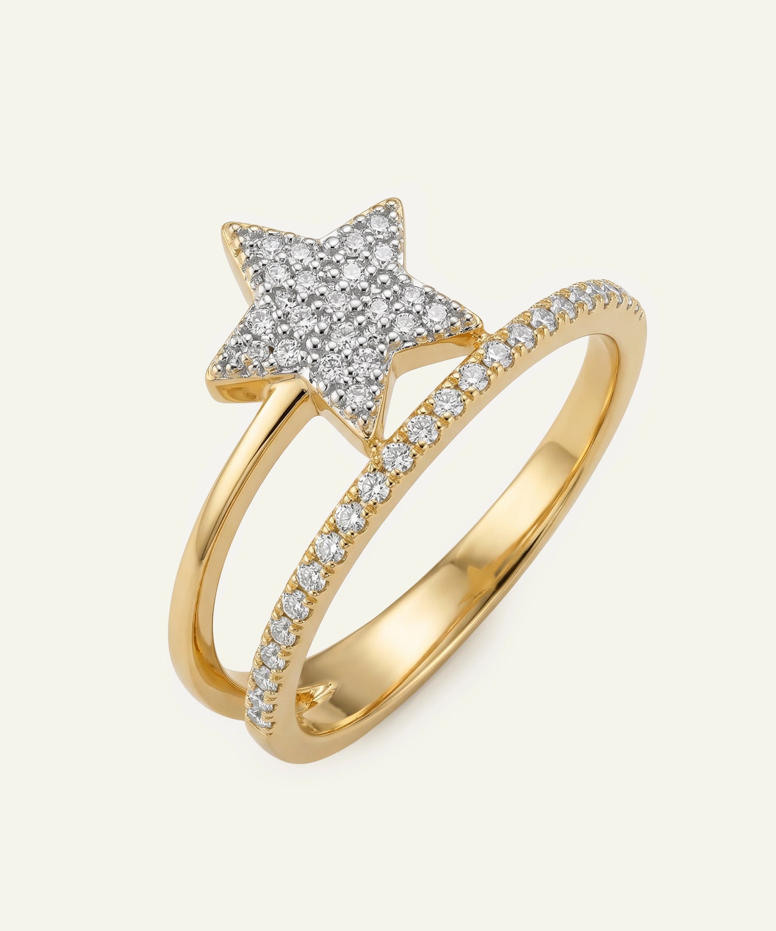 Gold ring with star-shaped design and diamond accents on a white background