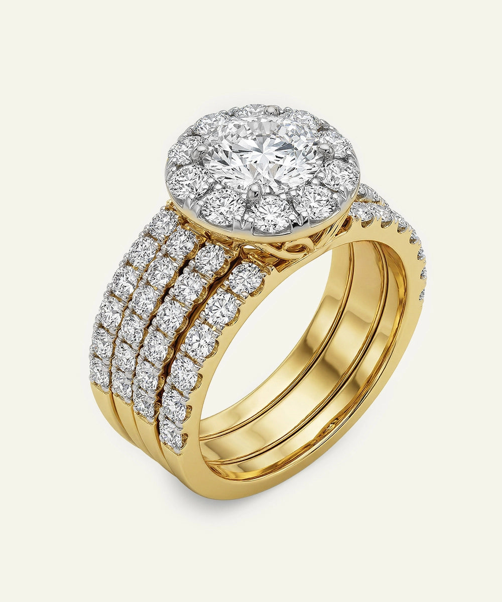 Gold ring with diamond accents on a light gray background