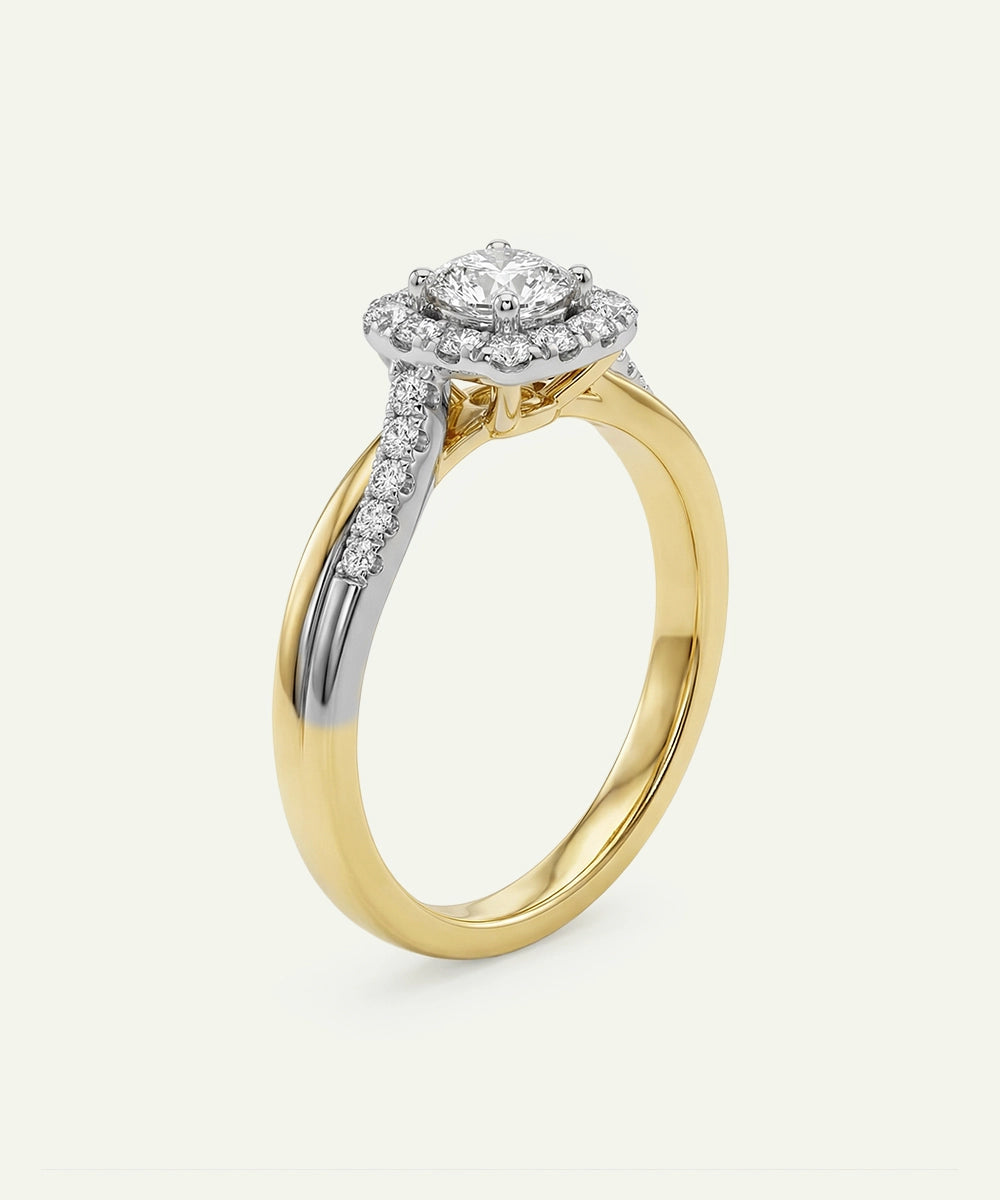 Gold and silver ring with diamond accents on a white background